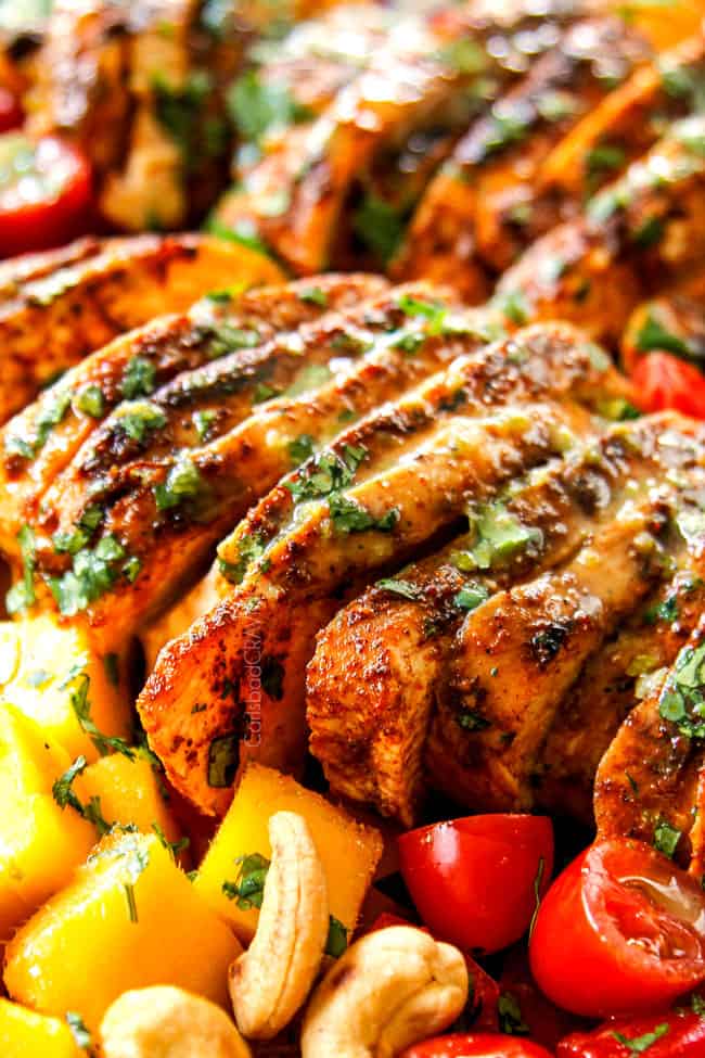 showing up close of chicken in mango salad showing how juicy chicken is