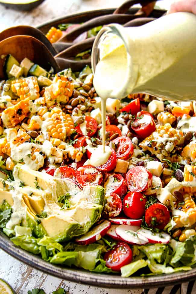 showing how to make Mexican Salad recipe by drizzling with Cilantro Lime Dressing