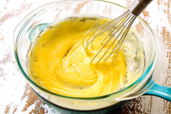 showing how to make Strawberry Shortcake by whisking lemon curd until thickened