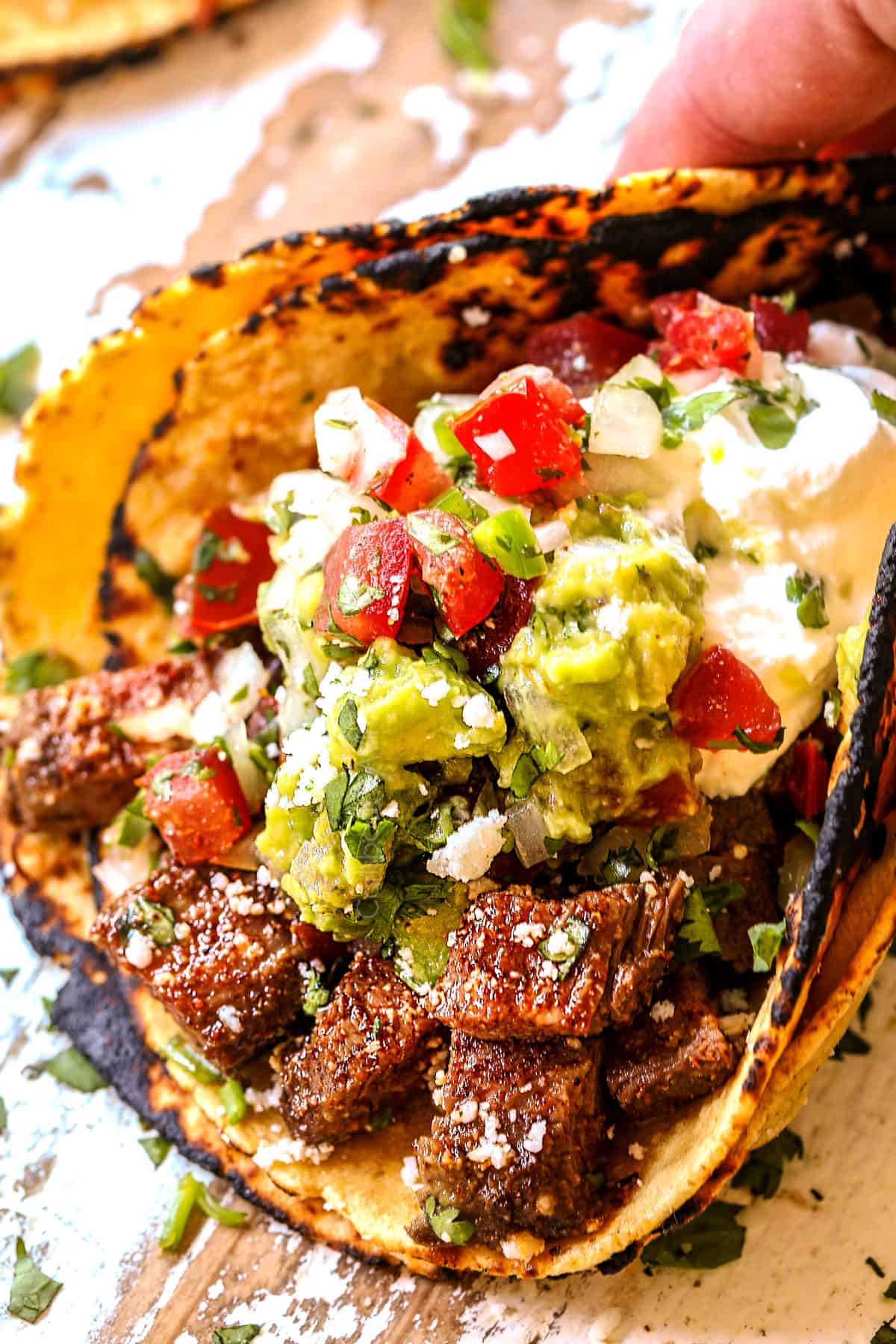 showing how to serve carne asada chopped in a taco