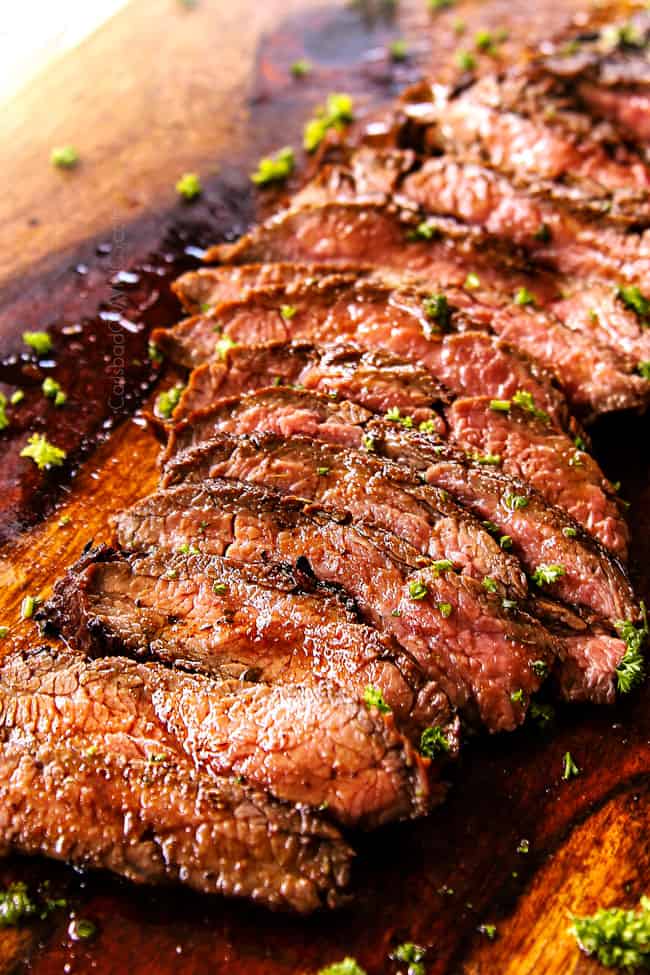showing how to make steak salad by thinly slicing steak