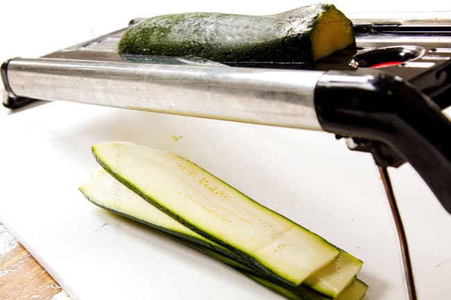 showing how to slice zucchini for zucchini lasagna with a mandoline slicer