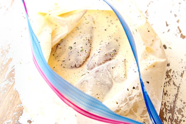 showing how to make Parmesan crusted chicken recipes by marinating chicken in buttermilk