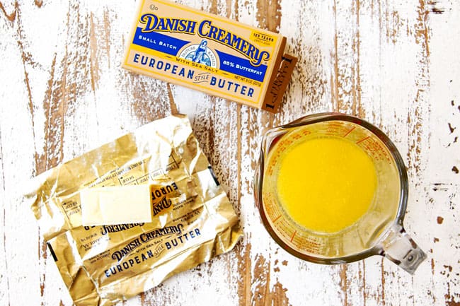 showing how to make Parmesan crusted chicken by melting butter in a measuring cup