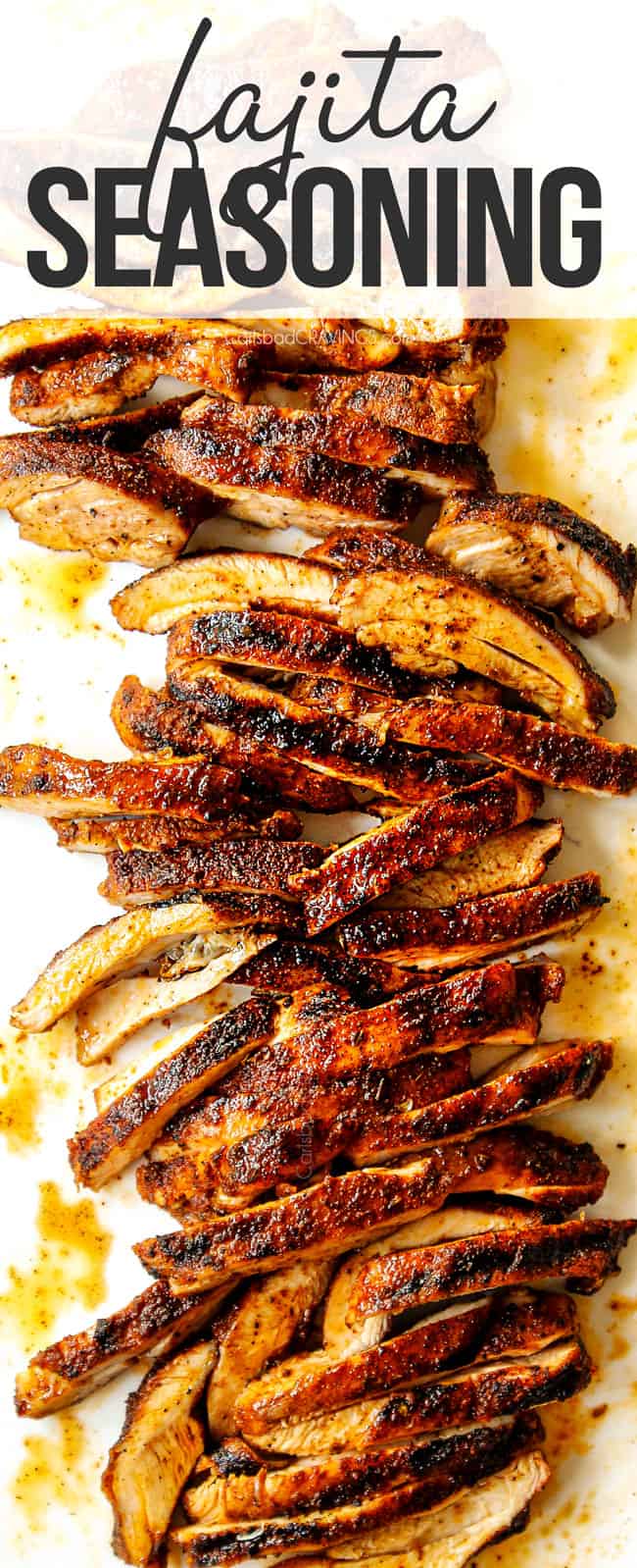 top view of sliced chicken on a white cutting board seasoned with fajita seasoning