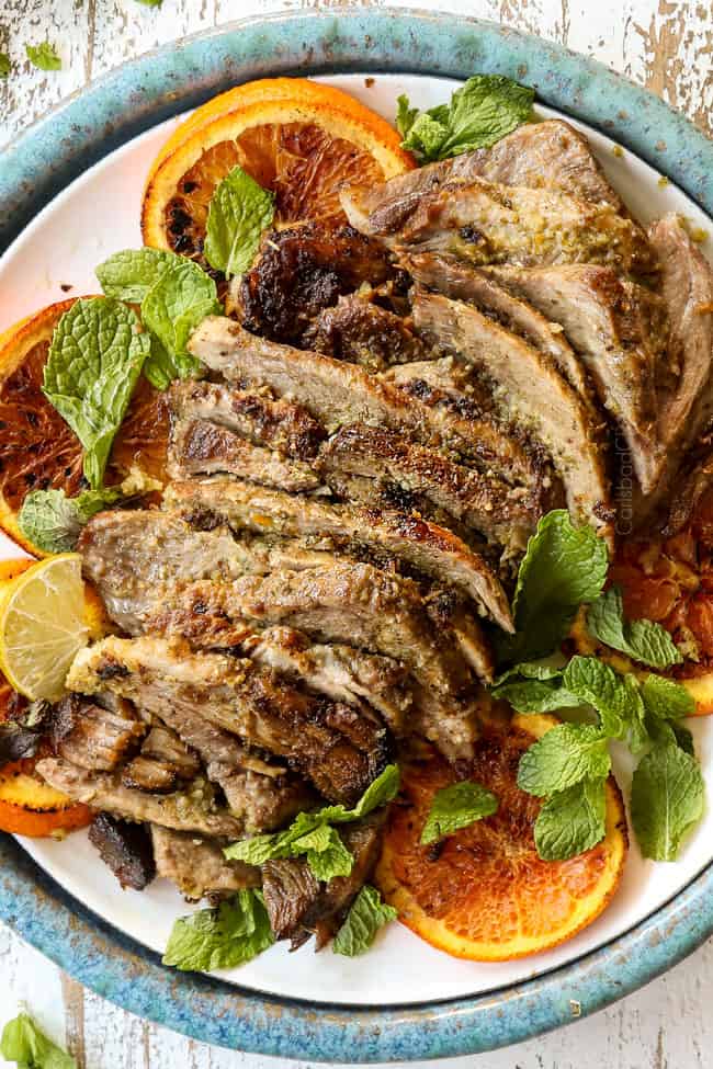 showing how to make mojo Cuban roast pork (lechon asado) by