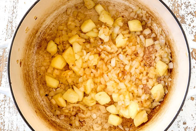 showing how to make pumpkin soup recipe by sweeting onions and apples