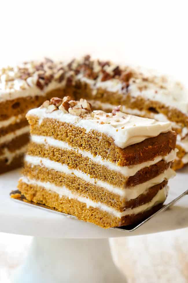 a slice of pumpkin spice cake showing the layers