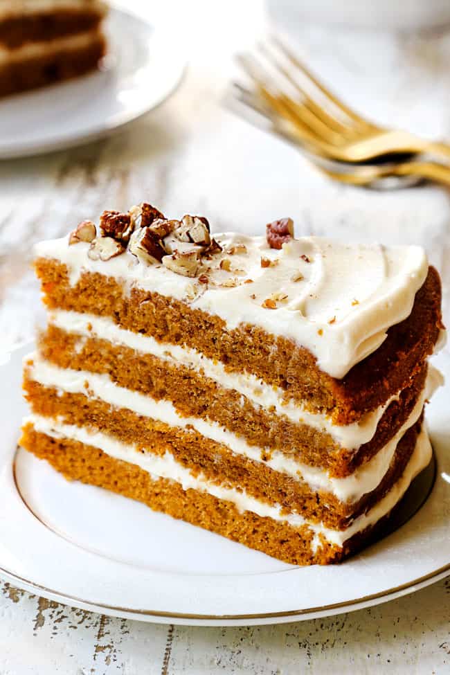 up close of a slice of pumpkin spice cake on a white plate