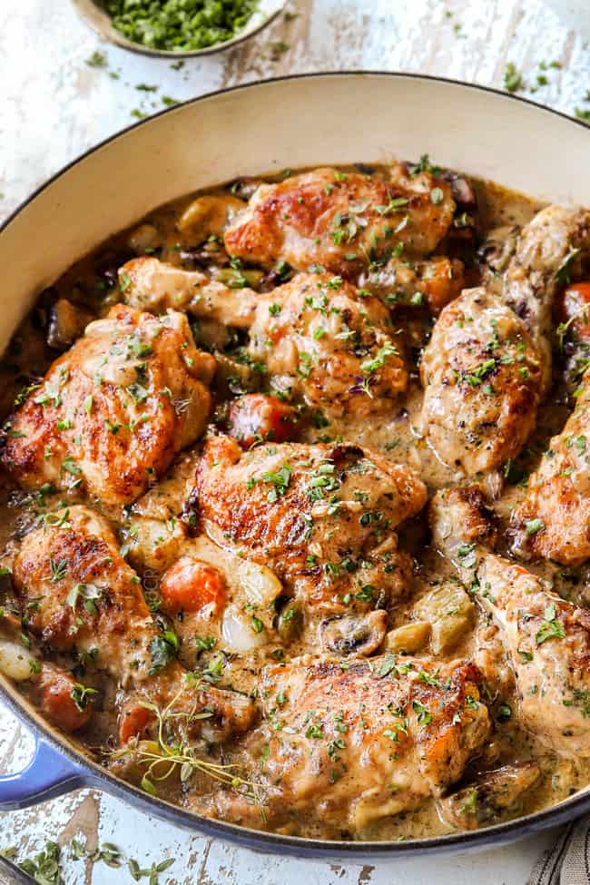 side view of chicken fricassee recipe in a blue braiser