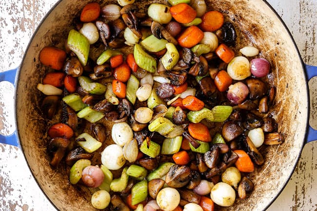 showing how to make chicken fricassee recipe by sautรฉing carrots, celery, onions and mushrooms until tender