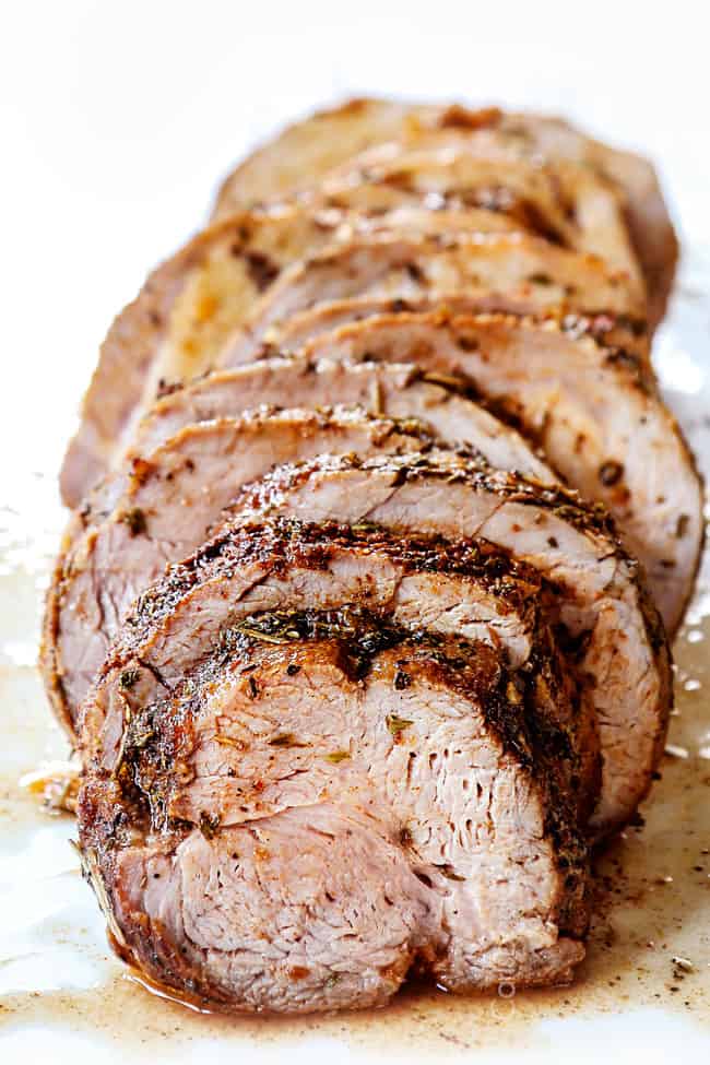 front view of slow cooker pork loin sliced, showing how juicy it is