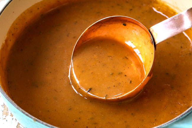 showing how to make poutine gravy by simmering in a saucepan until thickened