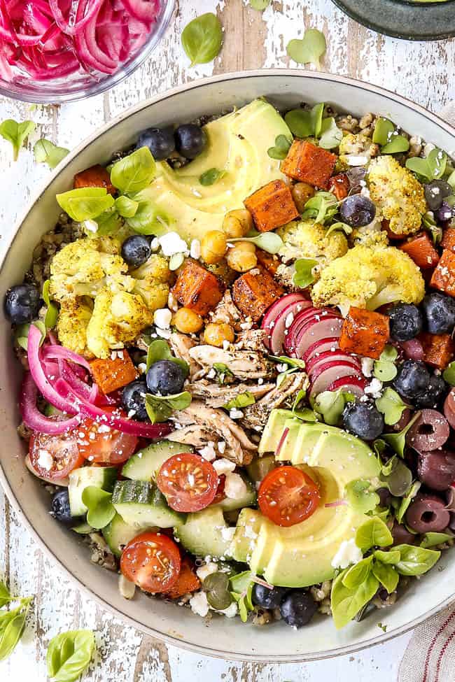 Sliced Greek Chicken Marinade on chicken in a rice bowl