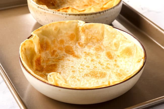 showing how to make taco bowl shells by adding pan fried tortilla to a bowls to bake