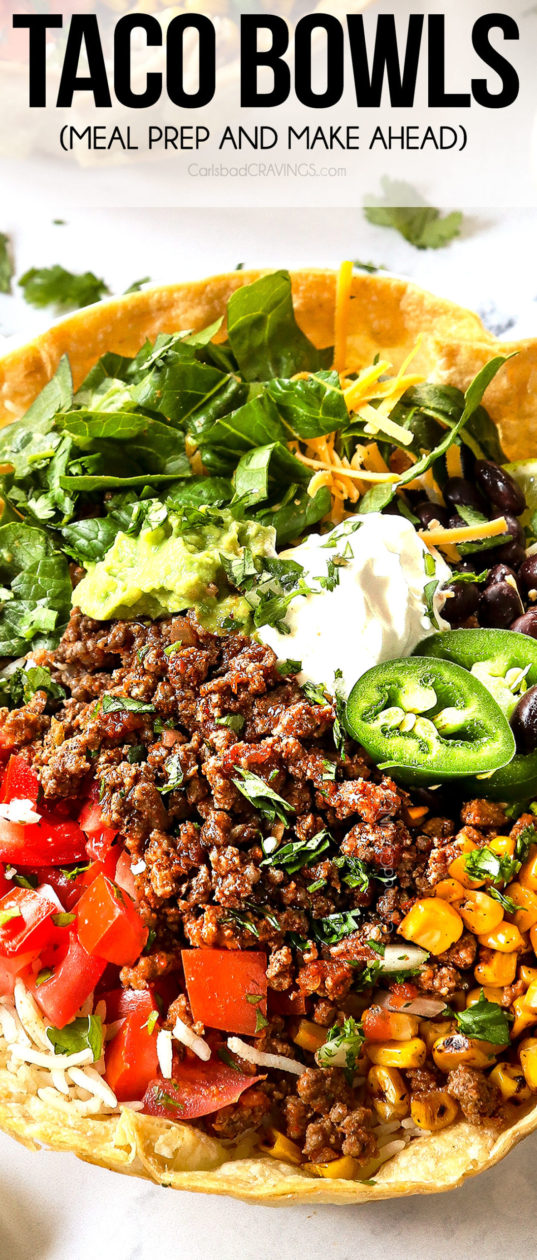 taco bowls with ground beef, tomatoes, corn beans, guacamole and sour cream