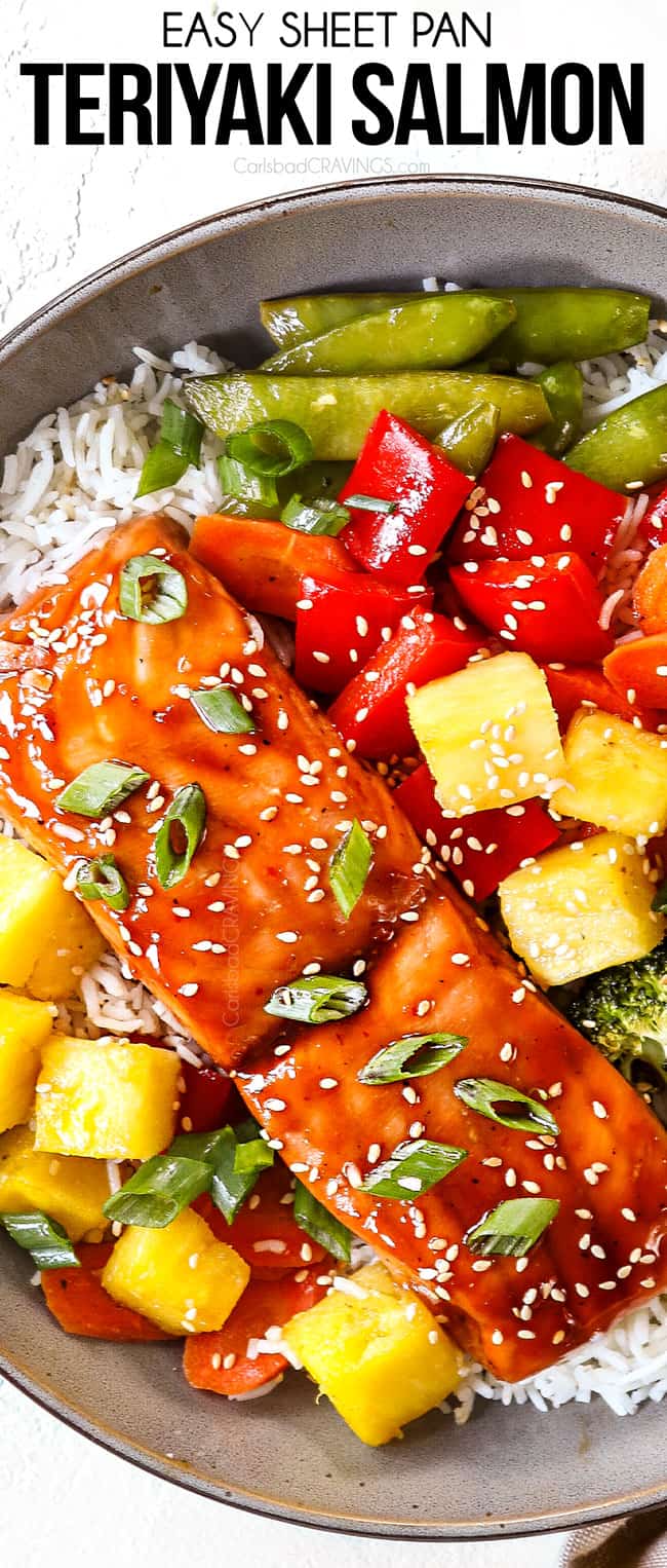 top view of teriyaki salmon in a bowl with pineapple, bell peppers and broccoli