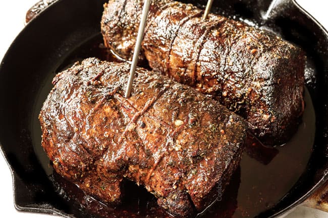 showing how to cook beef tenderloin by inserting meat probes into the beef so it cooks evenly