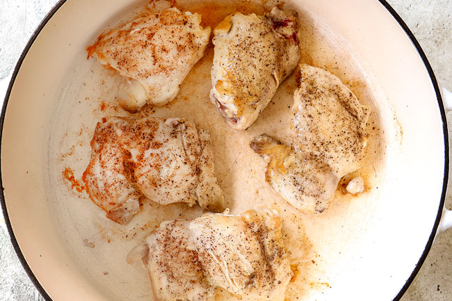 showing how to make chicken pot pie soup recipe by searing the chicken in a dutch oven until golden
