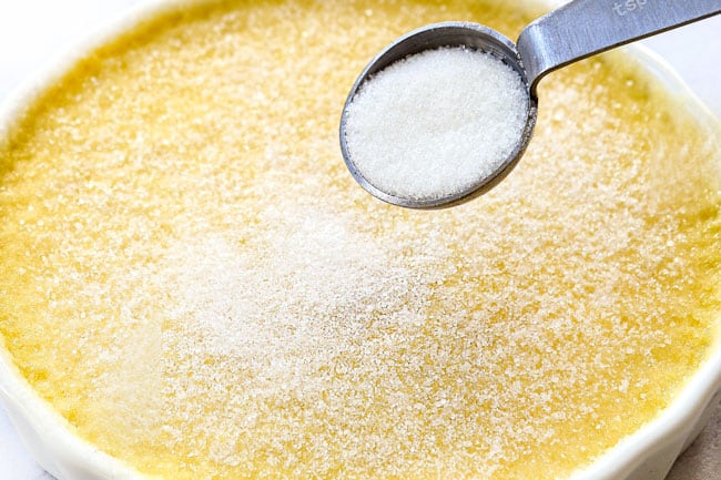 showing how to make creme brulee by adding sugar to top of custard