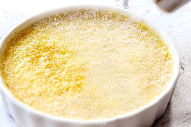 showing how to make creme brulee by caramelizing the top of the sugar topping with a creme brulee torch