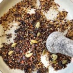 showing how to make corned beef by crushing corned beef spices with a mortar and pestle
