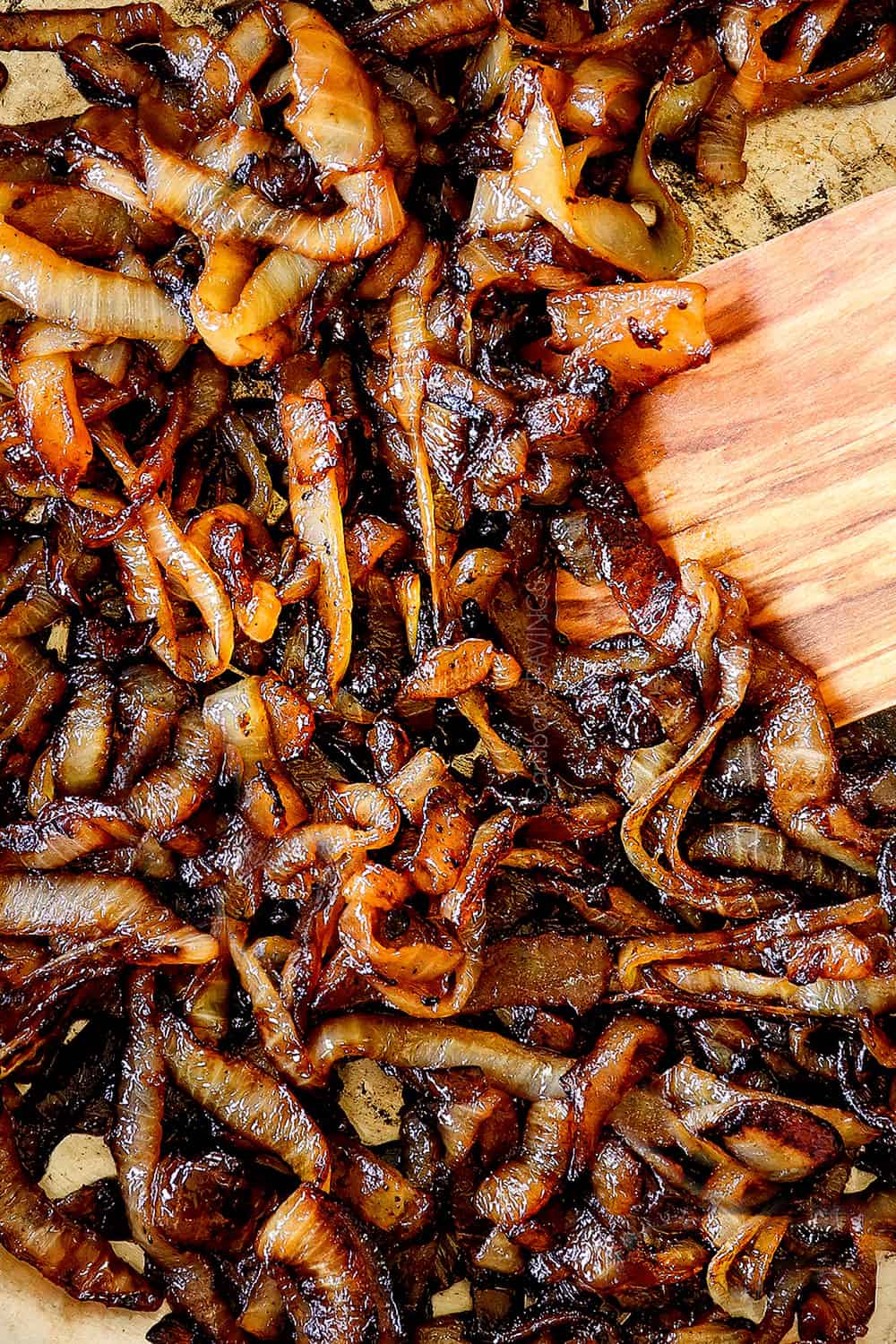 showing how to make French onion chicken by caramelizing onions in a skillet