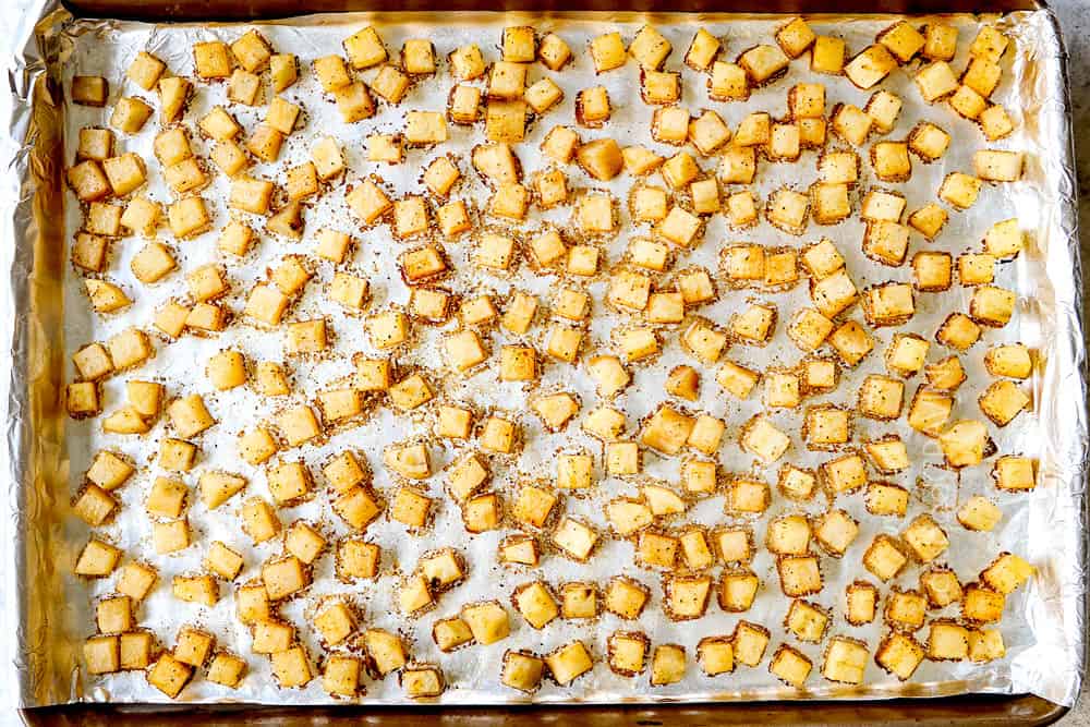 showing how to make corned beef hash by cooking potatoes in a baking pan