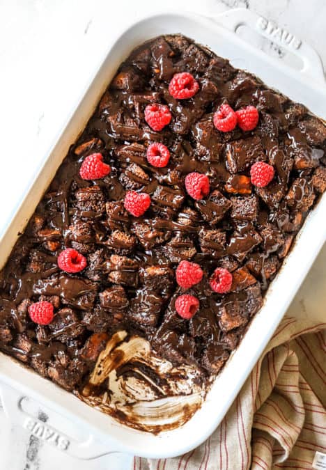 top view of bread pudding recipe in a 9x13 baking pan with a slice missing
