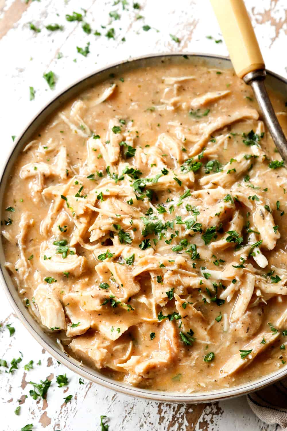 crockpot chicken and gravy in a bowl showing how creamy the gravy is