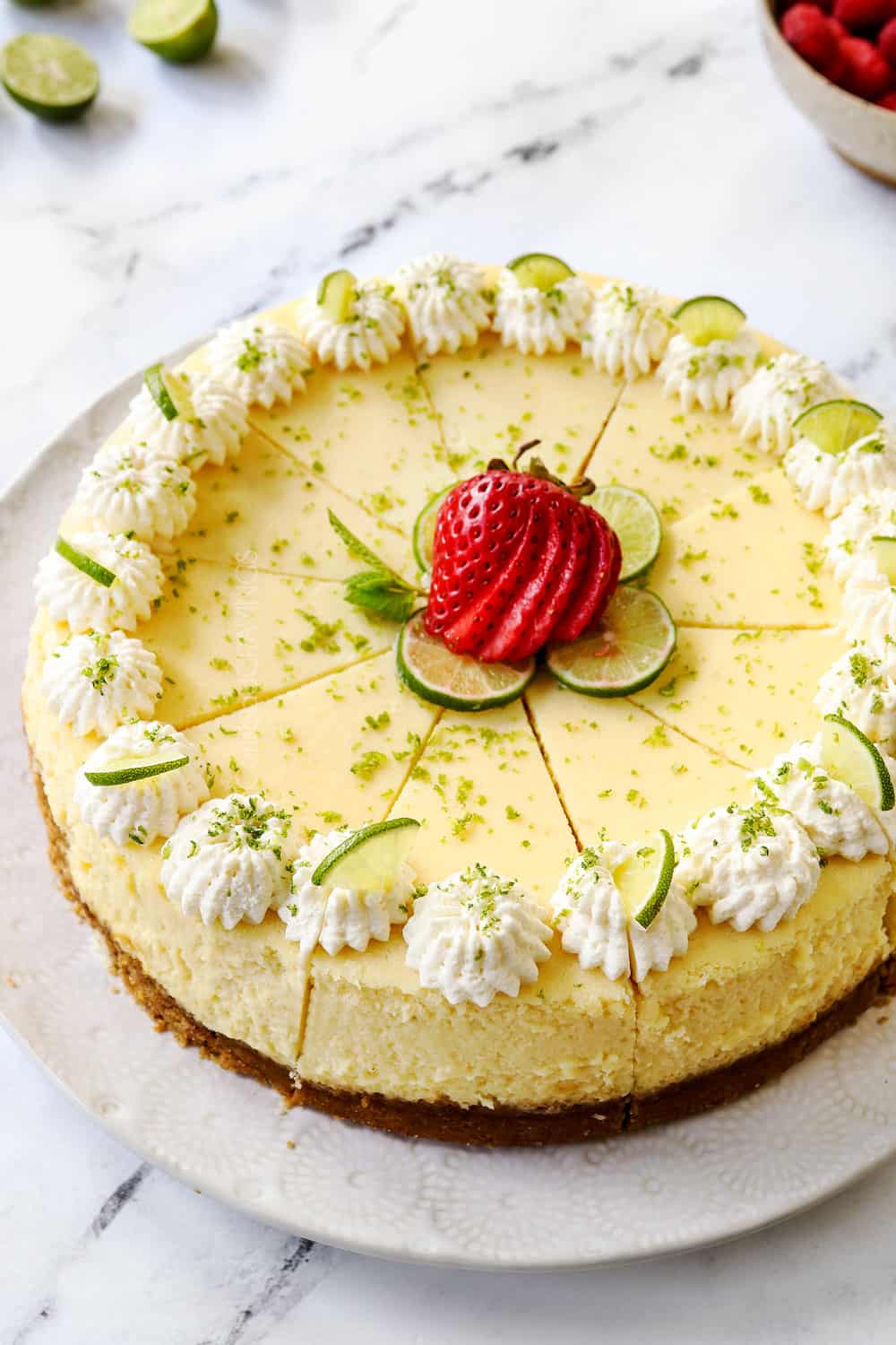 showing how to make key lime cheesecake by slicing into even pieces