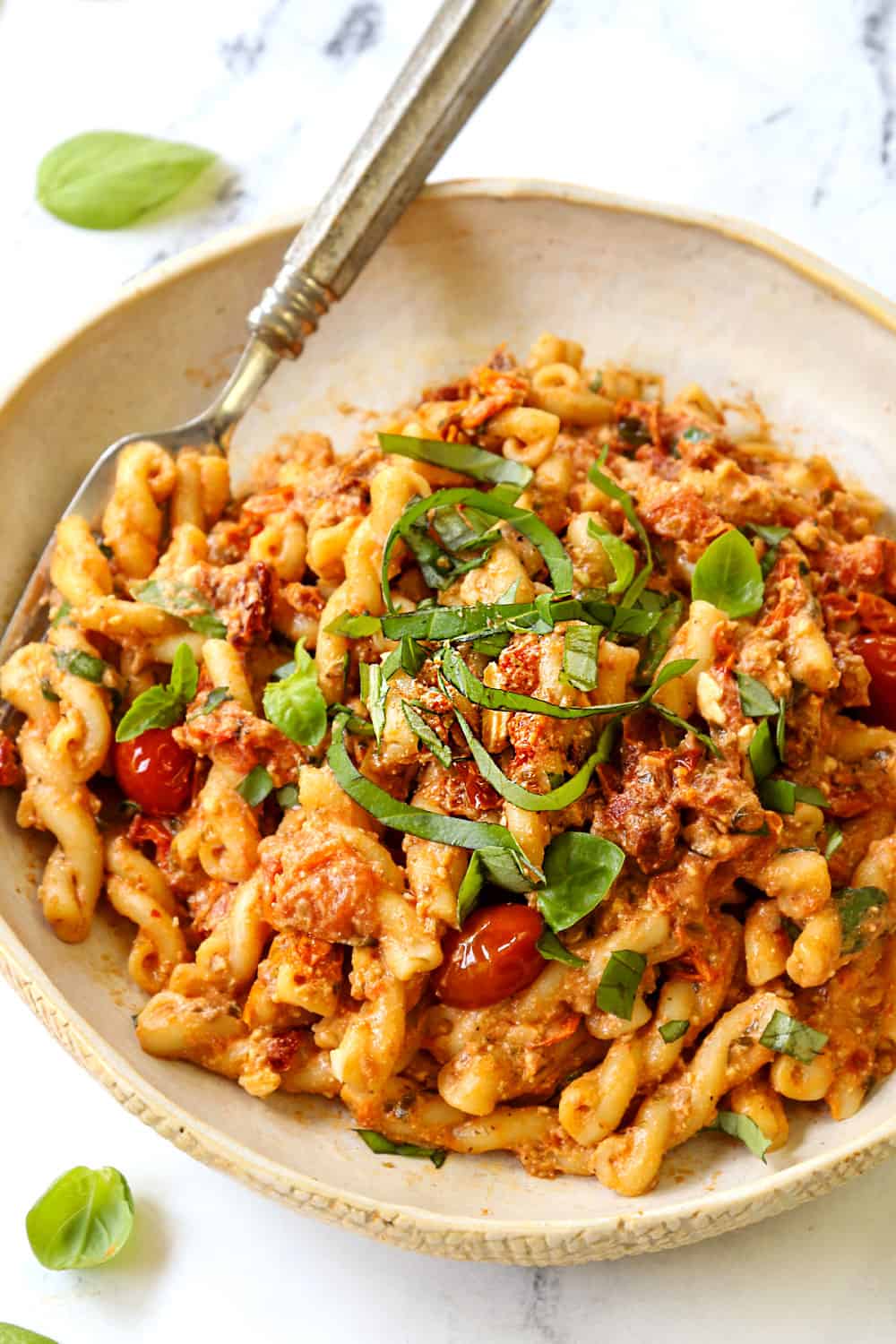 a plate of TikTtok feta pasta recipe with fresh basil