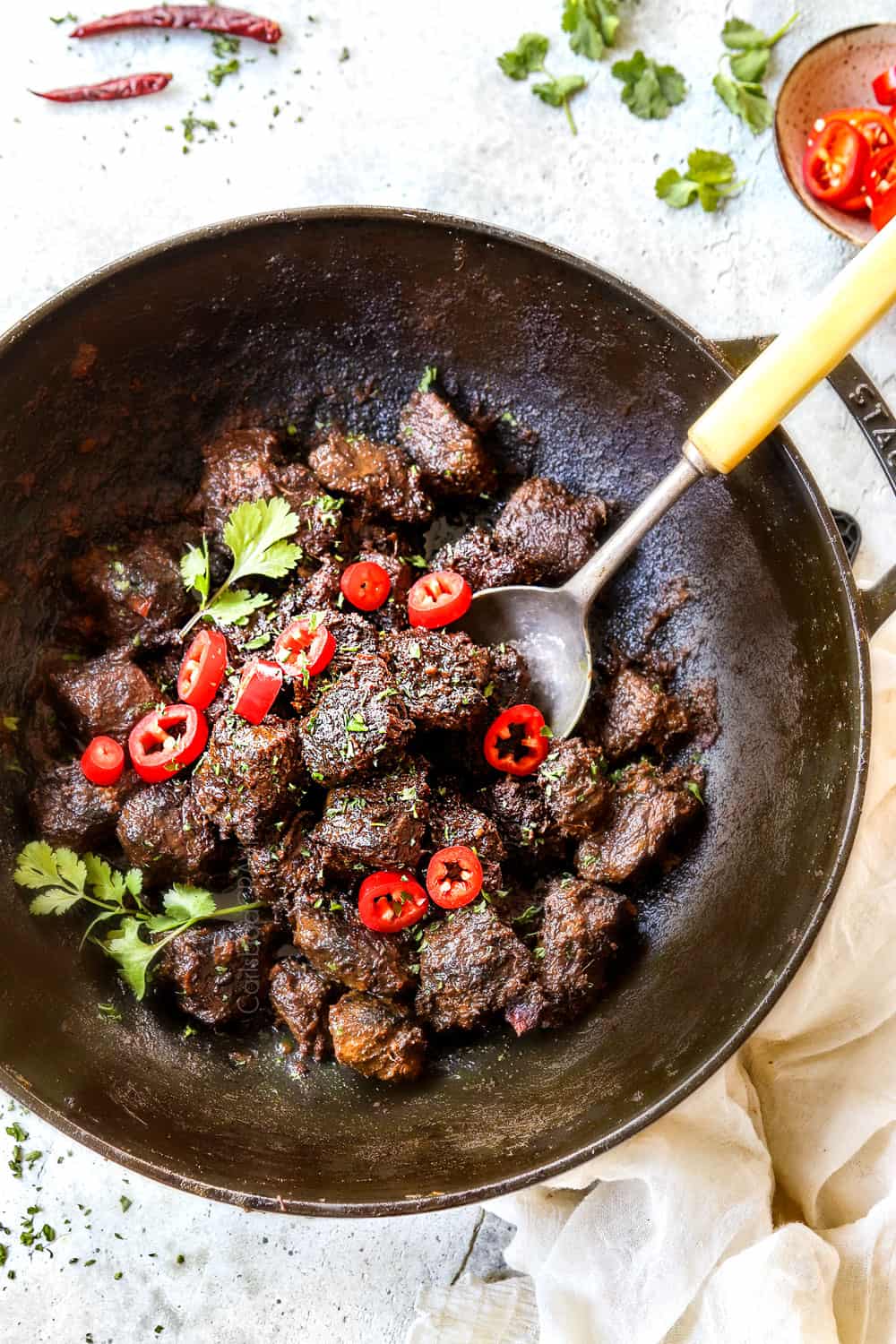 top view of beef rendang recipe in a black Dutch oven