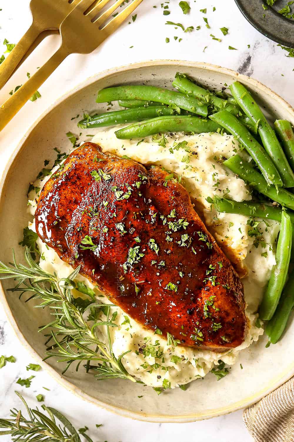 showing how to serve garlic brown sugar chicken with a top view of the chicken with mashed potatoes and green beans