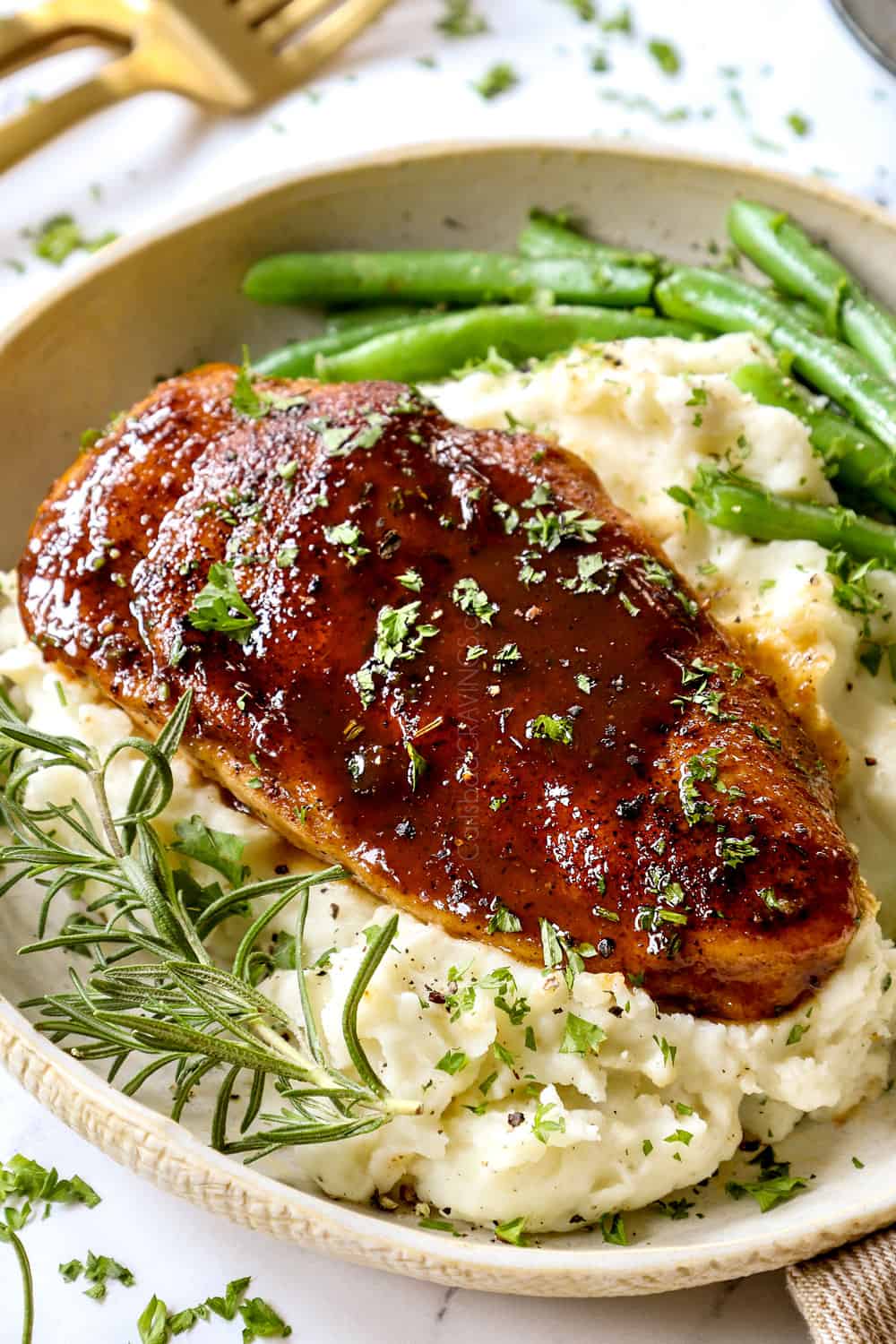 showing how to serve garlic brown sugar chicken with a side view of the chicken with mashed potatoes and green beans