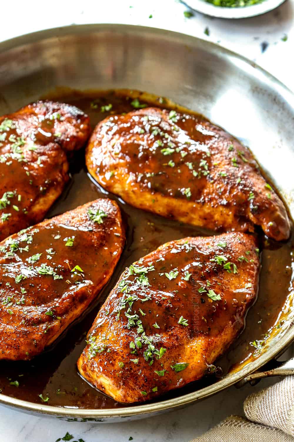 up close of garlic brown sugar chicken showing how juicy it is