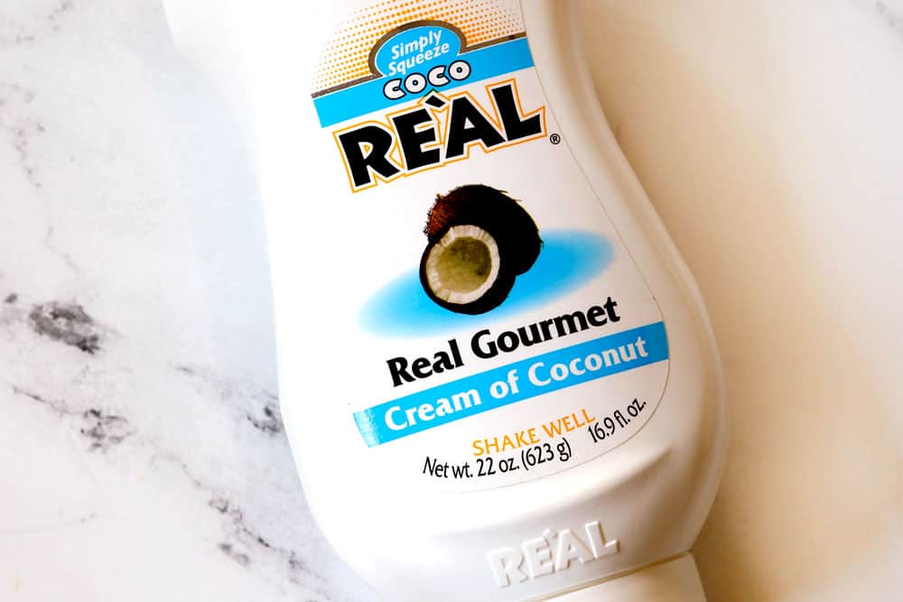 showing how to make coconut jasmine rice by displaying the secret ingredient: cream of coconut