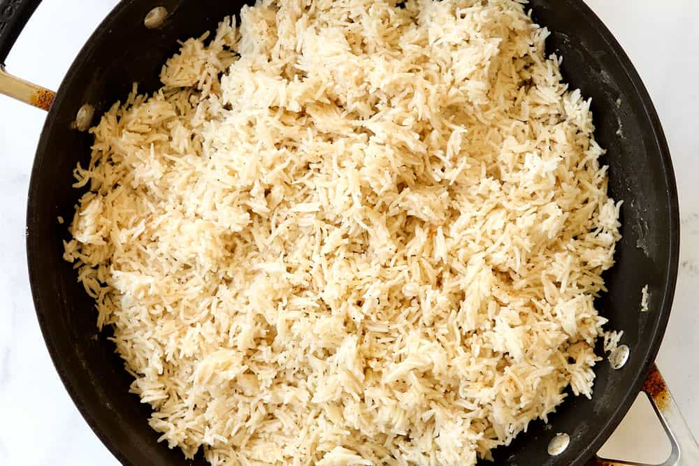 showing how to make coconut rice by letting it rest before fluffing