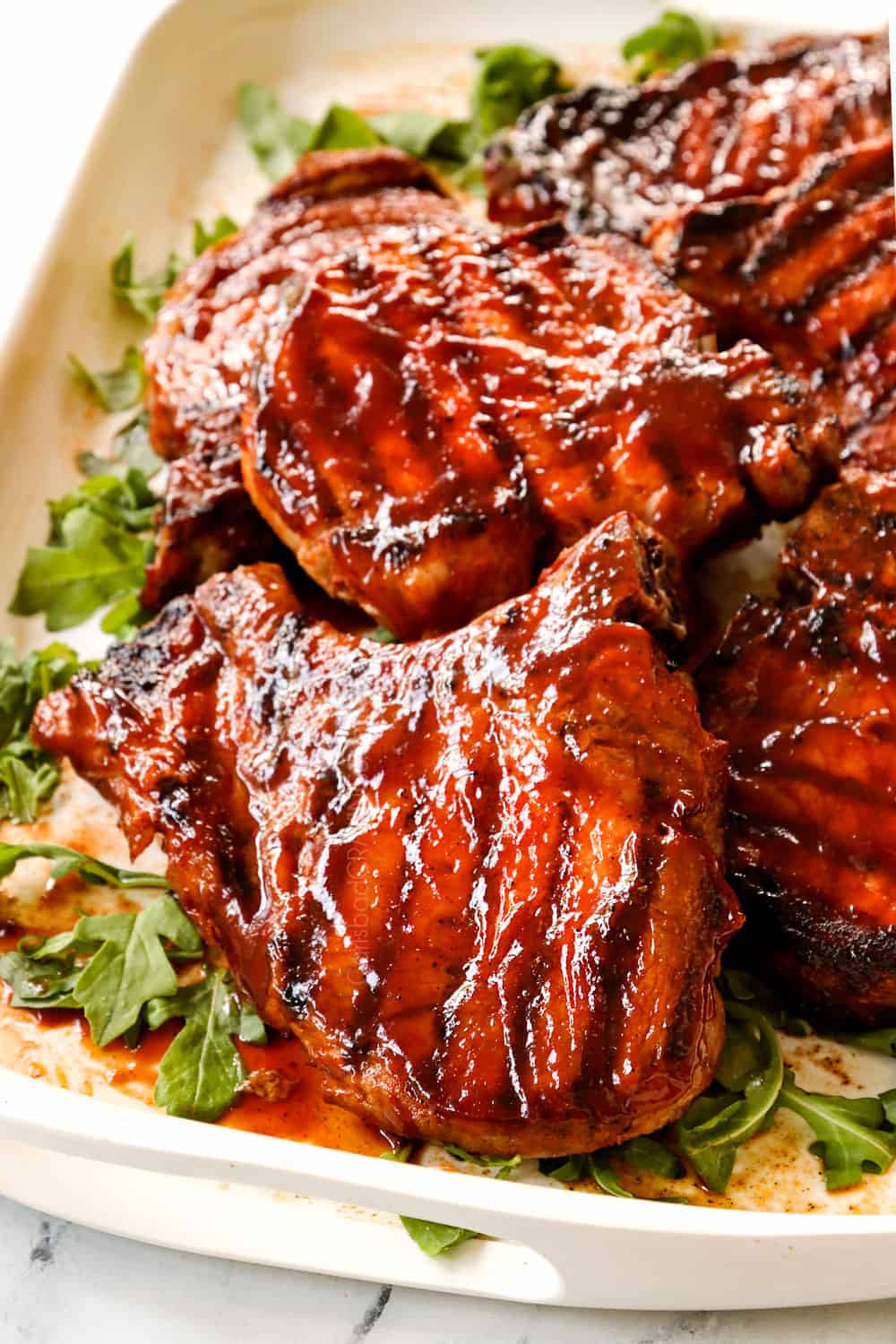 up close of grilled pork chops showing how juicy they are