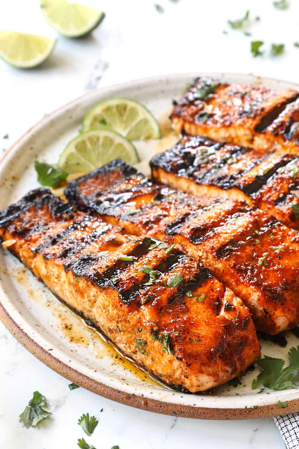 up close of a fillet of grilled salmon showing how juicy it is