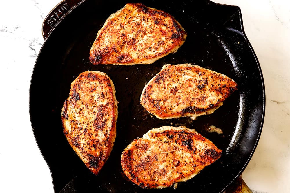 showing how to make chicken Caprese recipe by cooking chicken in a skillet until golden