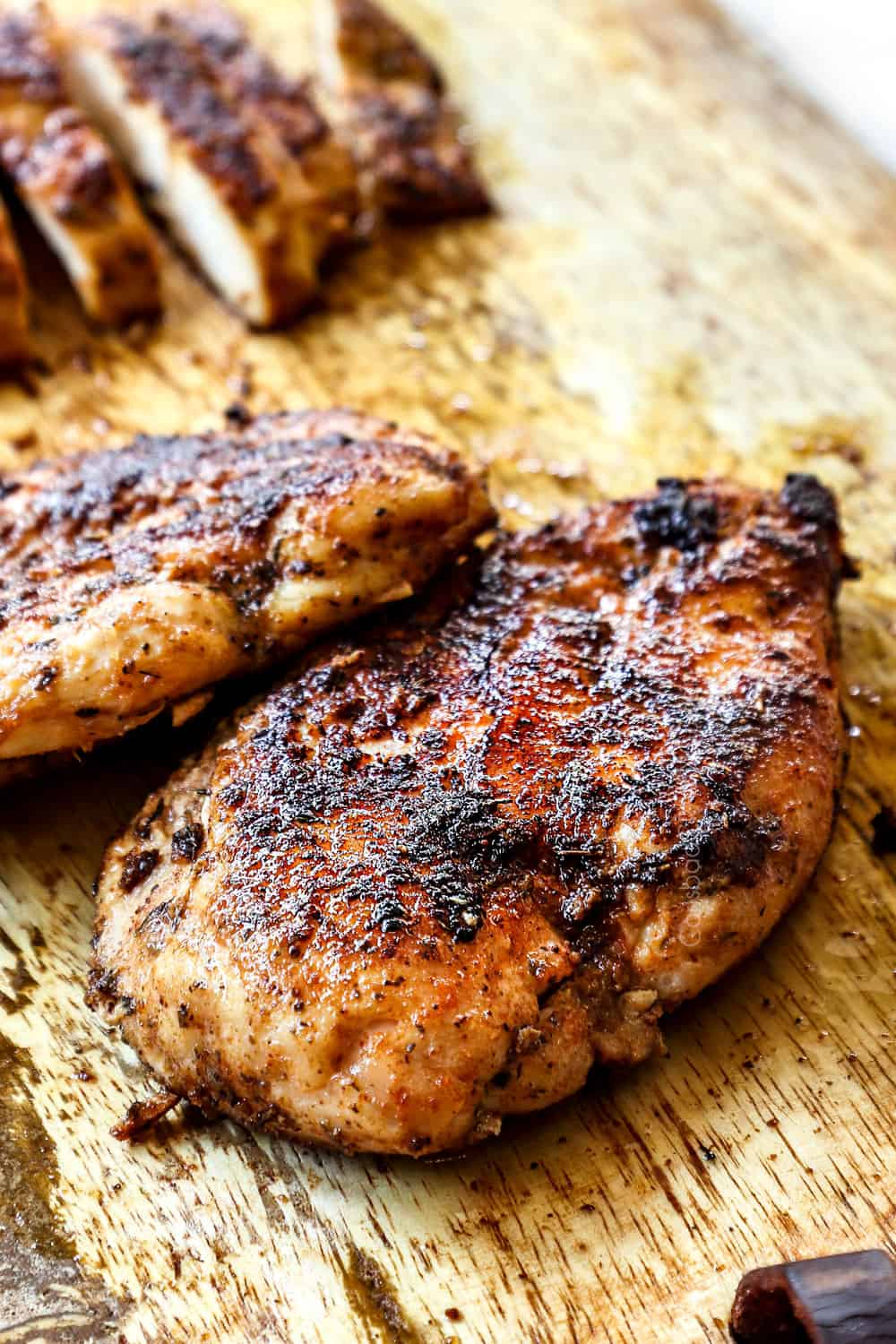 how to make green goddess salad with blackened chicken on a cutting board showing the blackened crust