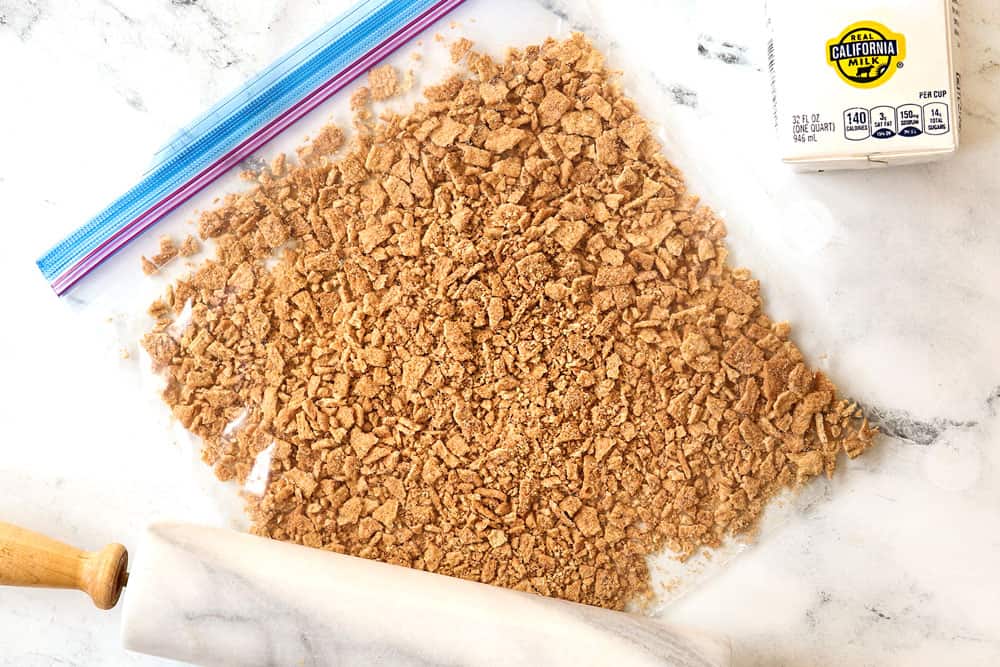 showing how to make cereal pancakes by crushing cinnamon toast crunch cereal in a bag