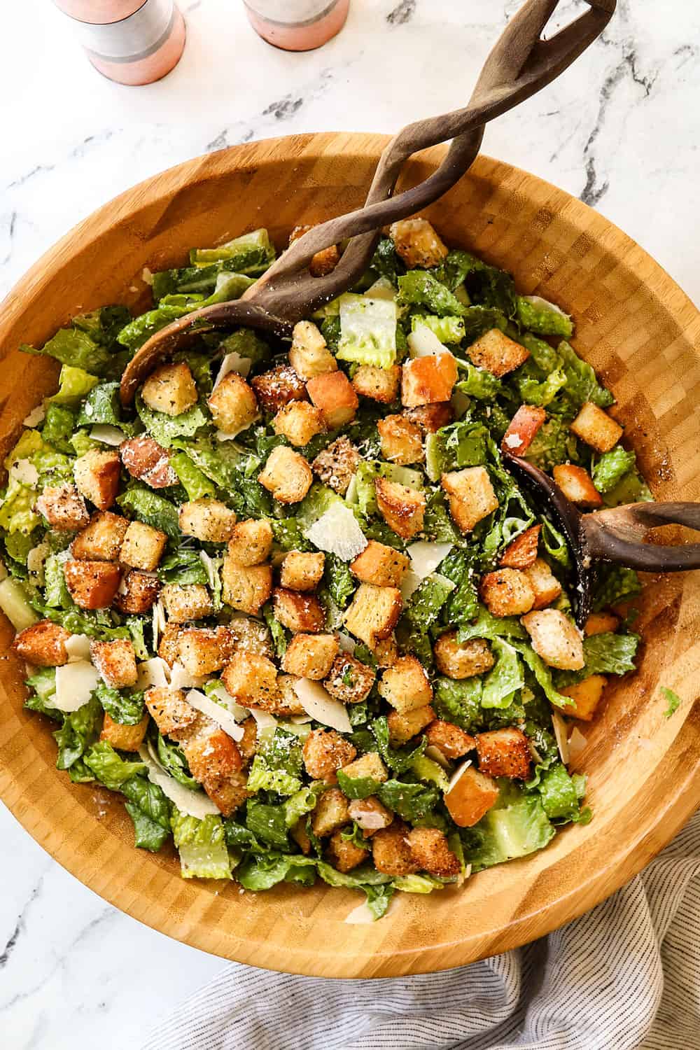top view of Caesar Dressing recipe with Romaine lettuce, Parmesan, croutons and Caesar Dressing
