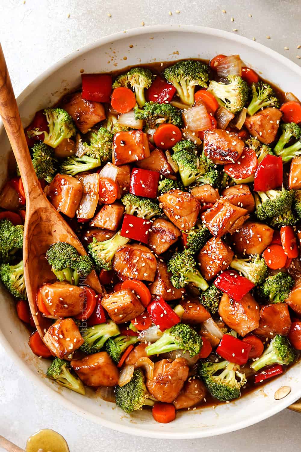 top view of honey garlic chicken stir fry recipe in a white skillet