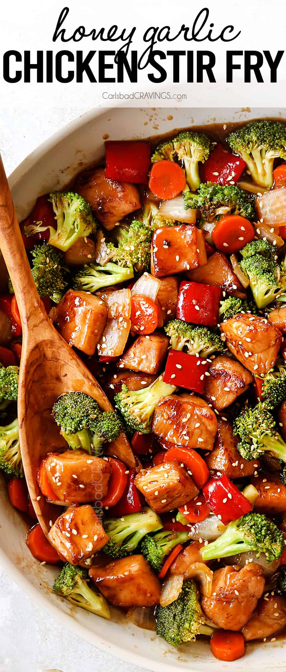 top view of honey garlic chicken stir fry in a white skillet