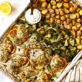 showing how to make lemon garlic chicken recipe by baking chicken thighs until golden