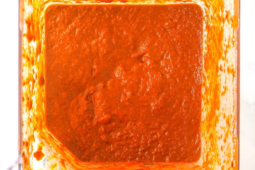 showing how to make birria for tacos by blending the chilies and broth in a high powered blender to make the consommรฉ