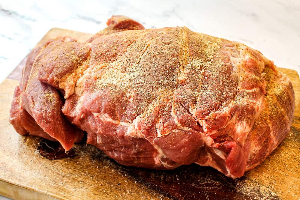 showing how to make Kalua Pork (Kalua Pig) recipe by seasoning the pork with Hawaiian sea salt