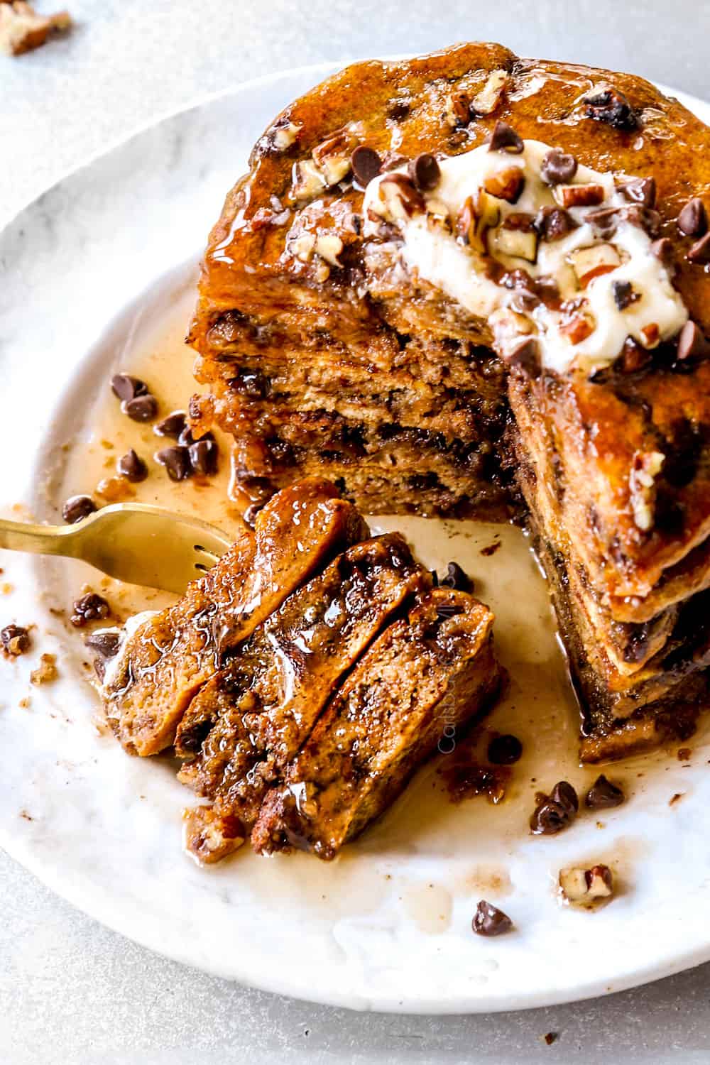 up close of a forkful of pumpkin pancake recipe showing how fluffy they are